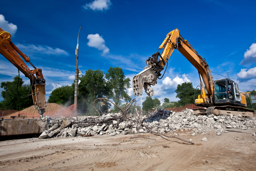 Site,demolition,with,crushing,equipments,machines,during,breaking,reinforced,concrete