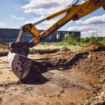 Excavator,working,at,house,construction,site, ,digging,foundations,for